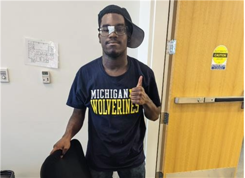 student giving a thumbs up